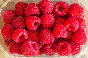 Fresh raspberries background closeup photo
