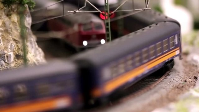 Model train with wagons is driving, blurred motion, full HD video