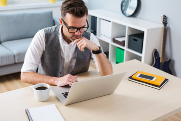 Man working on laptop from home
