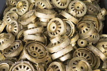 Pile of O-shaped parts before machining. Cast of bronze.