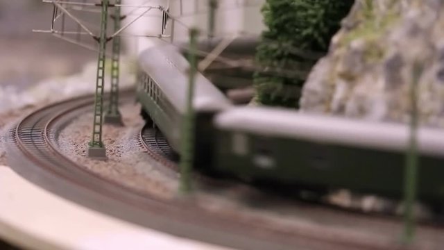 Model train with wagons is driving, blurred motion, full HD video