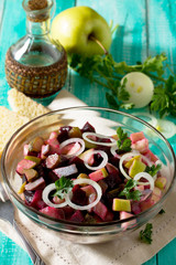 Salad with herring and vegetables (pickled cucumber, beetroot, a