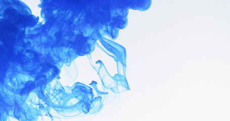 blue ink spreading in water, 4k photo