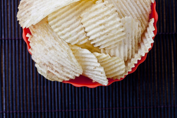 potato chips in red bowl