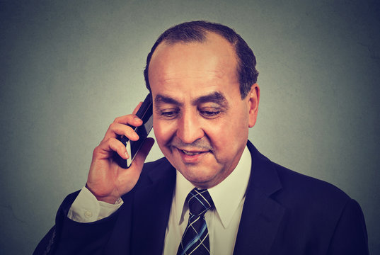 Middle aged business man talking on mobile phone