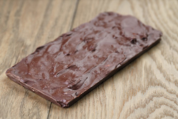homemade chocolate with almond nuts on wood table, shallow focus