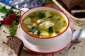 Soup with dumplings and meat, served with rye bread and chili.