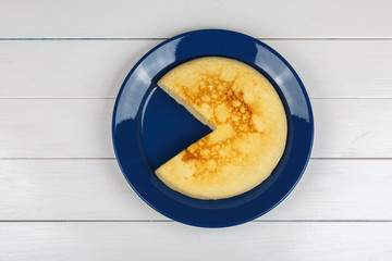 Backed pot cheese pie on white wooden background.
