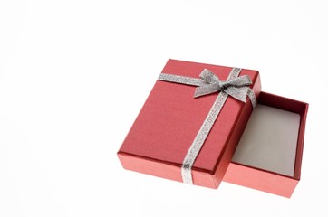empty red gift box with a silver ribbon