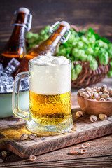 Homemade fresh beer with pistachios