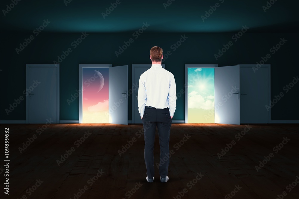 Sticker composite image of rear view of businessman with hands in pocket