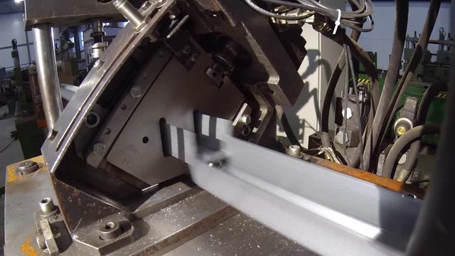 machine cuts a metal profile