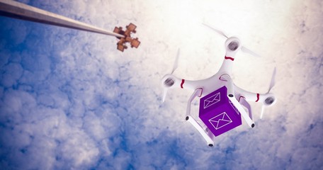 Fototapeta na wymiar Composite image of a drone bringing a purple cube