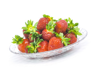 fresh whole strawberries glass plate