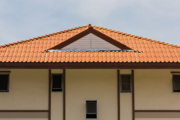 red rooftop against blue sky