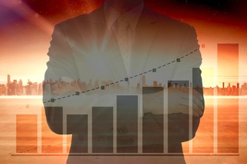 Composite image of midsection of businessman standing arms cross