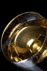 close-up of a glass filled with alcoholic beverage.