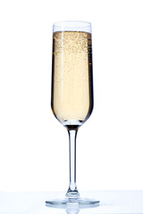 champagne flute full of champagne drink.