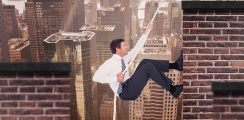 Composite image of businessman pulling a rope