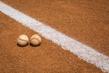 Baseball on a little league baseball field in spring