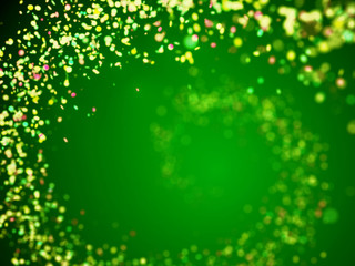 colorful glitter spiral in shades of green, yellow, pink and white with bokeh effect in front of a green background (3D illustration)