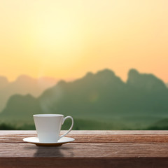 Cup of coffee on a wooden table.