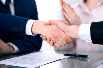 Business people shaking hands finishing up a meeting