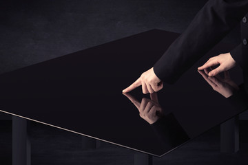 Close up of a hand touching smart table with copy space