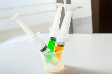 Syringe with syrup medicine use to feed for kids.