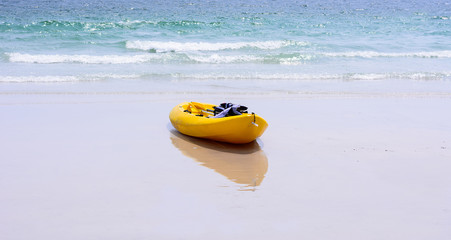 Colorful yellow kayaks on beach , Thailand