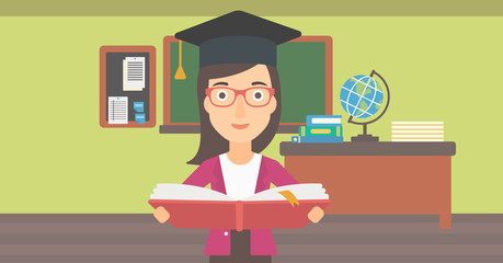 Woman in graduation cap holding book.