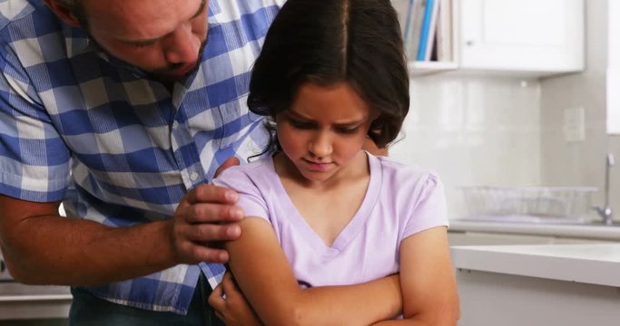 Daughter sulking to her father 
