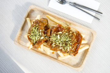 Spice Pork Ribs Served with baked potato chips.