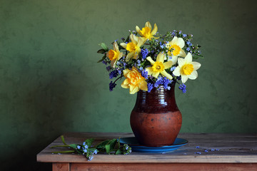 Still life with a spring bouquet with daffodils.