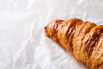 French pastry Croissant on white baking paper.