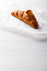 French pastry Croissant on white baking paper.