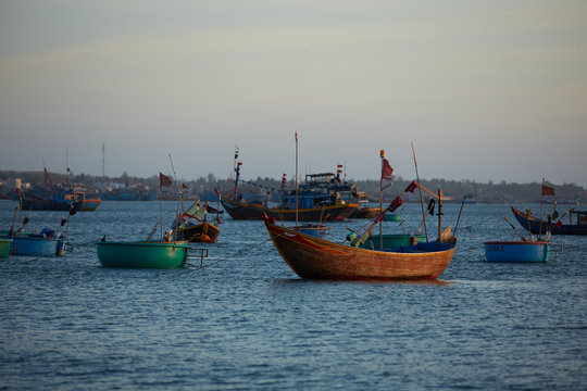 fishing boats in vietnam at sunset
