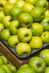 green apple background from market shelves real with flaws and b