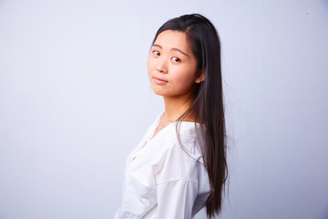 Fototapeta premium sad сhinese woman in white