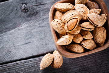 Almonds in a wooden bowl. 