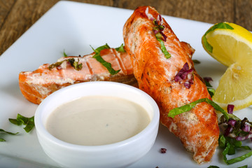 Baked salmon with sauce