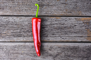 Red chilies on the rusty wooden table