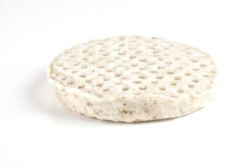 Frozen raw chicken meat over white background