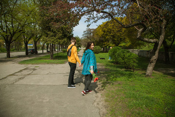 Fototapeta premium Young happy attractive couple walking together , outdoors