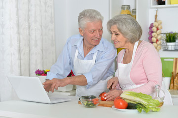 senior man and woman  in the kitchen