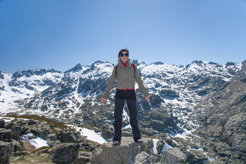 hiker woman posing on peak mountains