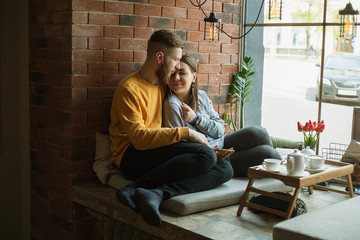 couple listening to music on headphones