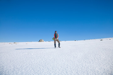 Fototapeta na wymiar hiker woman standing in snow