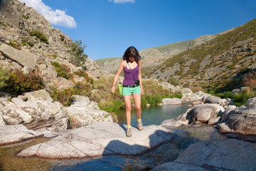 woman hiking on river
