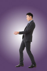 Holding pose of Asian business man